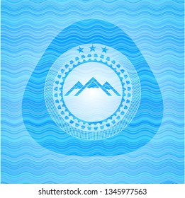 mountain icon inside water wave concept badge background.