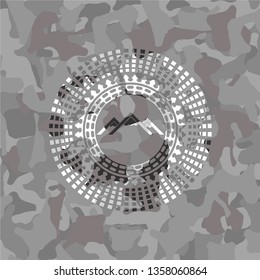 mountain icon on grey camouflage pattern