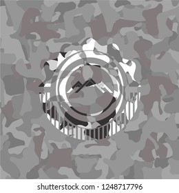 mountain icon on grey camouflaged pattern