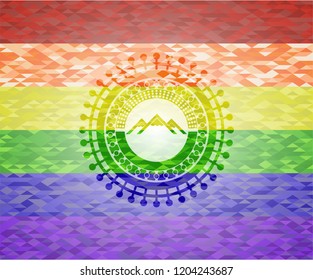 mountain icon on mosaic background with the colors of the LGBT flag
