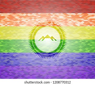 mountain icon on mosaic background with the colors of the LGBT flag