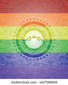 mountain icon on mosaic background with the colors of the LGBT flag