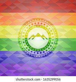 mountain icon on mosaic background with the colors of the LGBT flag