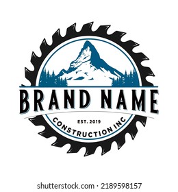 mountain logo vintage design in chainsaw. for home improvement construction and carpentry