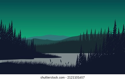 Mountain panorama with forest and lake silhouette from the out of the city at dusk