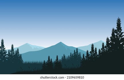 Mountain panorama with majestic silhouettes of pine trees from the edge of the surrounding village