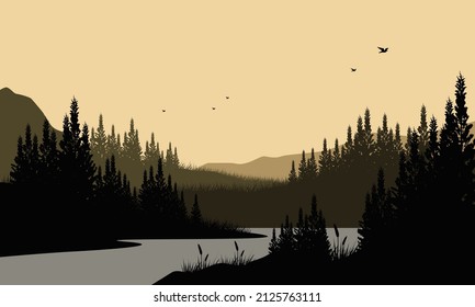 A mountain panorama silhouette with amazing big trees from riverside