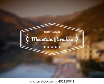 Mountain Paradise. Vector design of hotel logo on blurred background
