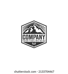 Mountain peaks inside hexagon frame vintage outdoor adventure logo vector graphic