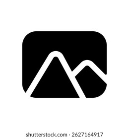 A mountain range is shown in a black and white photo. The mountains are tall and majestic