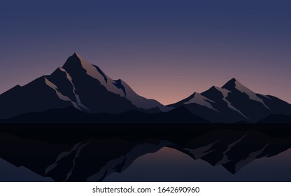 Mountain scenery with reflection during sunrise and sunset