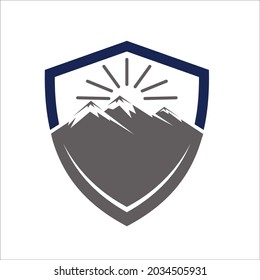 mountain in shield with sun, simple abstract design.