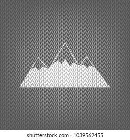 Mountain sign illustration. Vector. White knitted icon on gray knitted background. Isolated.