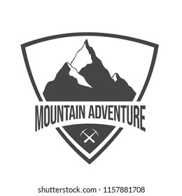 Mountain silhouette in a triangle can be used as stamp. Vector logo illustration with mountain silhouette isolated on light background
