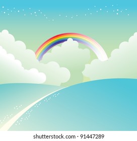 mountain slope and rainbow in sky