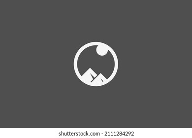 Mountain with sun in circle logo design