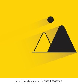 mountain and sun with shadow on yellow background