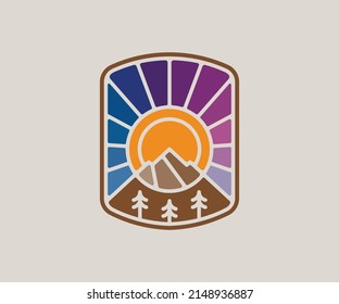 Mountain sunset emblem graphic. Stained glass style badge.