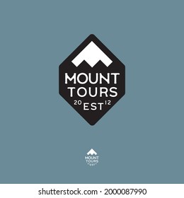 Mountain tours logo. Extreme sport emblem. Ice peaks and letters into rhombi badge. Emblem for sport, alpinism, sport equipment and clothing mark.