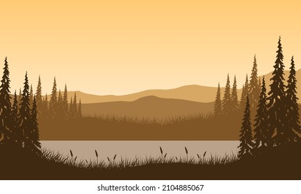 Mountain view with a fantastic silhouette of pine trees from the lakeside at dusk at night
