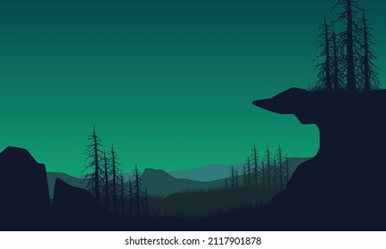 Mountain view with realistic dry tree silhouette of countryside beside the cliff