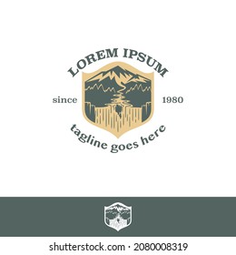 Mountain and Waterfall emblem in shield shape for outdoor adventure theme