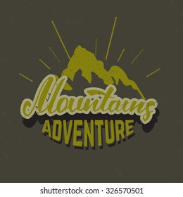 Mountains adventure emblem. Hand drawn lettering design element. Vector vintage typography concept.