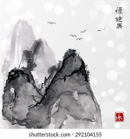 Mountains in fog hand drawn with ink in traditional Japanese painting style sumi-e on blurred glowing background. Contains hieroglyphs "well-being", "health", "eternity". Vector illustration.