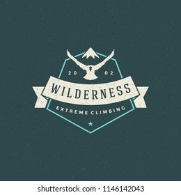 Mountains logo emblem vector illustration. Outdoor adventure expedition, mountains and flying eagle silhouettes shirt, print stamp. Vintage typography badge design.