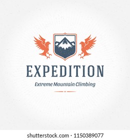 Mountains logo emblem vector illustration. Outdoor adventure expedition, mountains and flying eagle silhouettes shirt, print stamp. Vintage typography badge design.