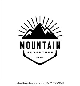 Mountains logo emblem vector illustration. Outdoor adventure expedition, mountains silhouette shirt, print stamp. Vintage typography badge design.