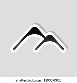 Mountains logo, simple icon. Sticker style with white border and simple shadow on gray background
