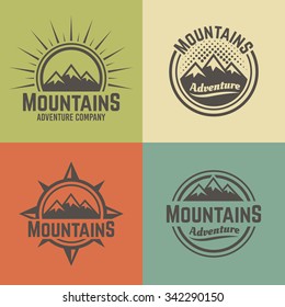 Mountains set of four vector colored vintage badges, labels, emblems and logos, hiking and climbing, travel and mountain camping 