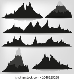 Mountains silhouettes on the white background.set of hand drawn landscape with silhouette mountain peaks.
