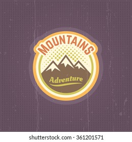 Mountains vector vintage round colored label, emblem, sticker on purple background with grunge texture