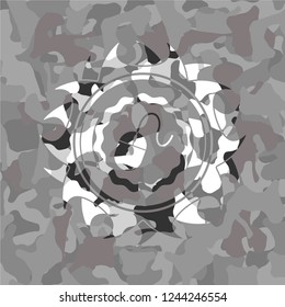 mouse icon inside grey camouflaged emblem