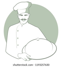 Moustached chef with a kitchen hat carrying a covered tray