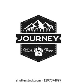 Moutnain Journey Badge. Wild and Free Logo. Camping adventure emblem in retro silhouette style. Featuring mountains and forest. Stock vector hiking label isolated on white background.