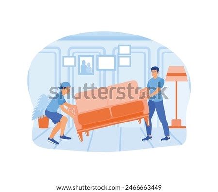 Move to a new house. Two men lifted and moved the sofa. Home Repair concept.