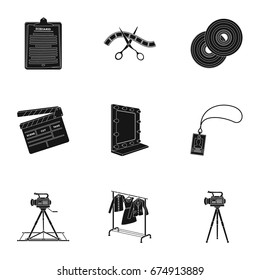 A movie camera, a floodlight, a chromakey and other equipment for the cinema.Making movie set collection icons in black style vector symbol stock illustration web.