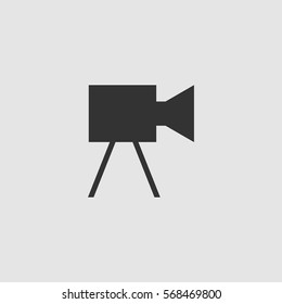 Movie camera icon flat. Black pictogram on grey background. Vector illustration symbol