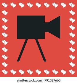 Movie camera icon flat. Simple black pictogram on red background with white hearts for valentines day. Vector illustration symbol
