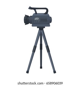 Movie camera on a tripod. Making a movie single icon in cartoon style vector symbol stock illustration web.