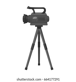 Movie Camera On A Tripod. Making A Movie Single Icon In Monochrome Style Vector Symbol Stock Illustration Web.