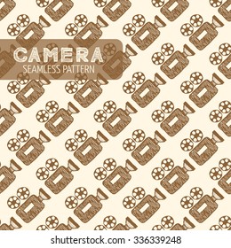 Movie camera seamless pattern. Vintage style, hand drawn pen and ink.  Vector seamless pattern for wrapping. Retro design element for electronics store or cinema packaging