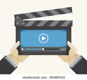 Movie clapper board with abstract video player window in director's hands. Concepts: Online films, Youtube, Instagram, Cloud computing movies database, Mobile streaming, Advertisement, Advertising.