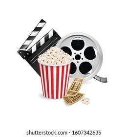 Movie Clapper Board, Cinema Ticket, Popcorn in the Striped Bag and Film Reel Over White Background. Cinematography Movie Festival Concept