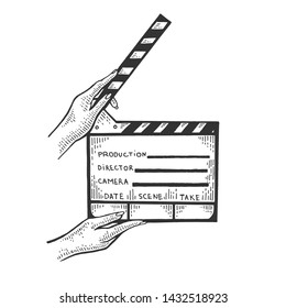 Movie clapperboard in hands sketch engraving vector illustration. Scratch board style imitation. Black and white hand drawn image.