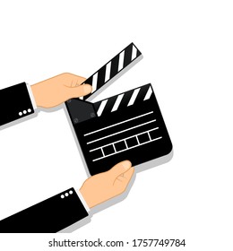 Movie clapperboard in human hands. Film icon. Cinematography concept. Vector on isolated background. Eps 10.