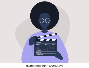 Movie production, young female character holding a clapper board, video industry